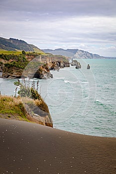 sea shore rocks and mount Taranaki, New Zealand