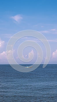 Sea sky cumulus cloud landscape view background. Calm water alone fishing boat. Destination aim progress concept