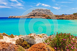 Sea skyview landscape photo with Feraklos castle near Agia Agathi beach on Rhodes island, Dodecanese, Greece. Panorama with sand