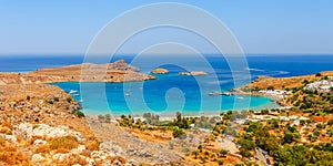 Sea skyview landscape photo Lindos bay and castle on Rhodes island, Dodecanese, Greece. Panorama with ancient castle and clear