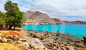 Sea skyview landscape photo near Agia Agathi beach and Feraklos castle on Rhodes island, Dodecanese, Greece. Panorama with sand