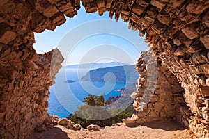 Sea skyview landscape photo from ruins of Monolithos castle on Rhodes island, Dodecanese, Greece. Panorama with green mountains