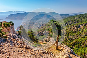 Sea skyview landscape photo from ruins of Monolithos castle on Rhodes island, Dodecanese, Greece. Panorama with green mountains
