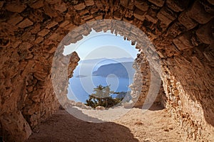 Sea skyview landscape photo from ruins of Monolithos castle on Rhodes island, Dodecanese, Greece. Panorama with green mountains