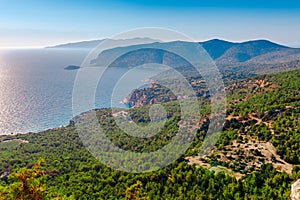 Sea skyview landscape photo from ruins of Monolithos castle on Rhodes island, Dodecanese, Greece. Panorama with green mountains