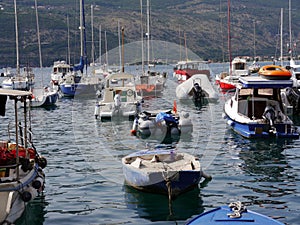 Small motor yachts with masts in port photo