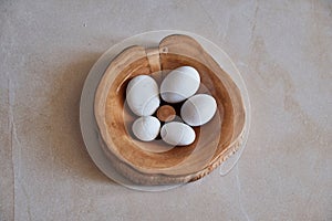 Sea Smoothed White Marble Pebbles in Wooden Bowl