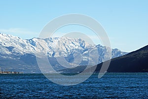 The sea and the snow-covered slopes