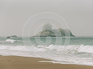 Sea stack in the Pacific Ocean, seen from the Elephant Seal Viewing Point, in San Simeon, California