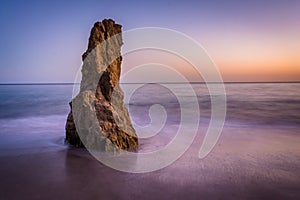 Sea stack in the Pacific Ocean at sunset, at El Matador State Be