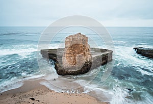 A Sea Stack takes on incredible storm waves near Santa Cruz California