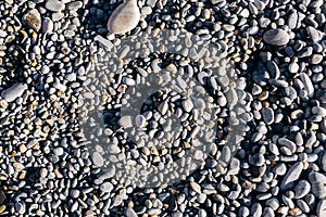 Sea stones background. Small pebbles or stone in garden. Texture background.