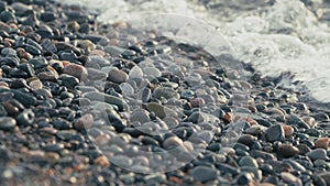 Sea Stones In The Sea Water And Ripples. Pebble Stones By The Sea.