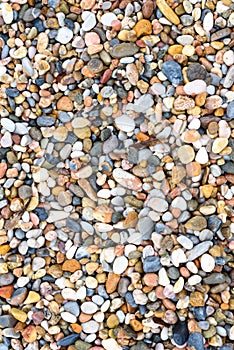 Sea stones texture background, top view