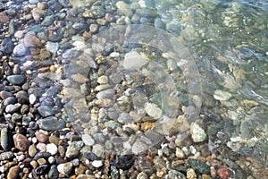 Sea stones in the water of Black Sea. Sochi.