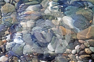 Sea stones in the water of Black Sea. Sochi.