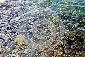 Sea stones in the water of Black Sea. Sochi.