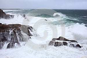 Sea storm at rocky coast