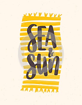 Sea And Sun slogan handwritten with elegant cursive font on beach towel or blanket. Summer resort composition. Trendy