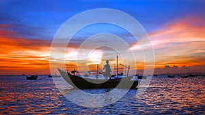 Sea sunset with boat silhouette, man