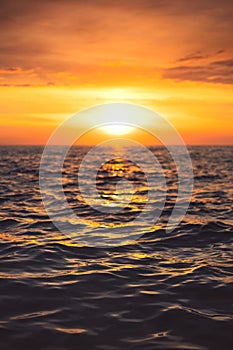 Sea sunset and ocean ripples waves as water texture background