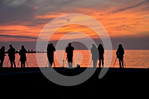 Sea sunset and photographers