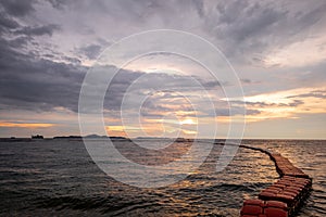 Sea and sunset with red buoy view of safe swimming zone