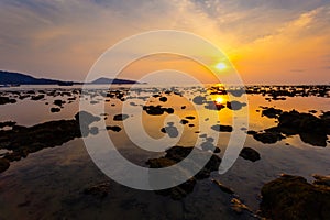 Sea at sunset rocky beach