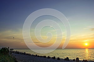 Sea sunset with a silhouette of para-glider