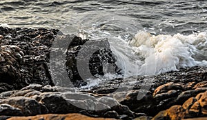 Sea surf splashing at rock