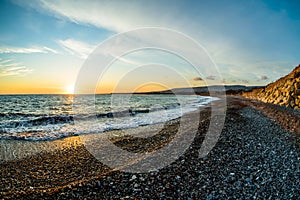 sea surface and sunny summer rocky coastline