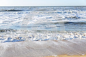 Sea surface with waves with white foam. Space for text. Background