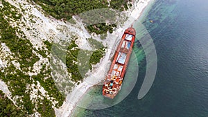 Sea tanker, dry cargo ship, washed ashore after a storm, aerial view