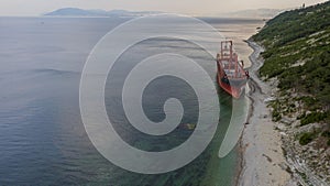 Sea tanker, dry cargo ship, washed ashore after a storm, aerial view