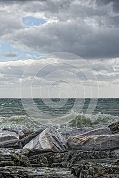 Sea in tempest on rocks photo