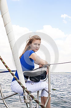 Sea Travelling Concepts: Sensual Caucasian Woman Sailing on Yacht Outdoors