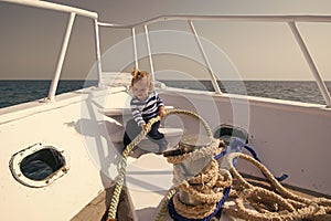 Sea trip concept. Small kid enjoy sea trip on boat. Boy sailor on sea trip. Sea trip and cruise. Let your dreams set