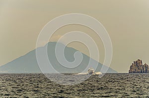 Sea tyrrhenian ferry rock and volcano stromboli