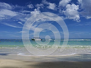 Sea view from beach on passing by boat