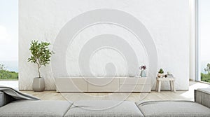 Sea view living room of luxury summer beach house with TV stand and wooden cabinet.