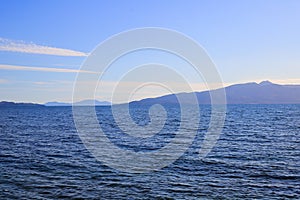 Sea view with moountains and blue sky