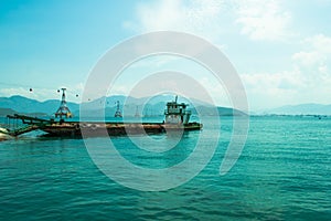 Sea view with old cargo ship