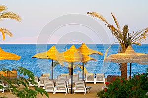 Sea view with parasols and deck chair