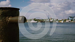 Sea view from the pier to the industrial port in the bay. Footage. A smooth transition of focus from the background of