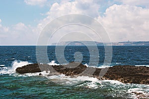 Sea view with rock and waves horizontal