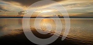 Sea View Sunset Photo. Cloudy Sky