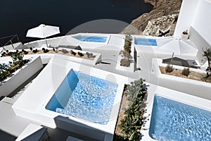 The sea view terrace and pools at luxury hotel on Santorini island, Greece
