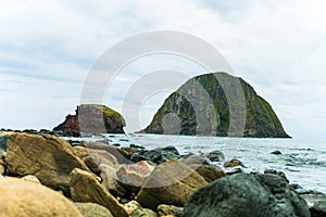 sea view and two small islands named Yen Phu Yen Sun at sea, Vietnam.