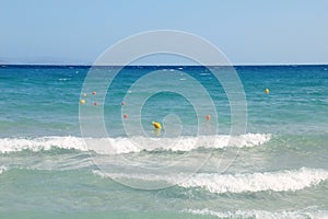 Sea view at vacation summer day. Sea surface close up shot, blue sky with clear horizon, nobody. Beautiful summer background for