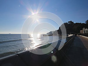 Sea Wall Dawlish looking out at sea in the sun